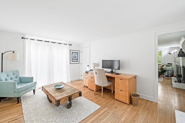17 High St, Merrimac, MA 01860 - home office with light wood finished floors, ornamental molding, and baseboards