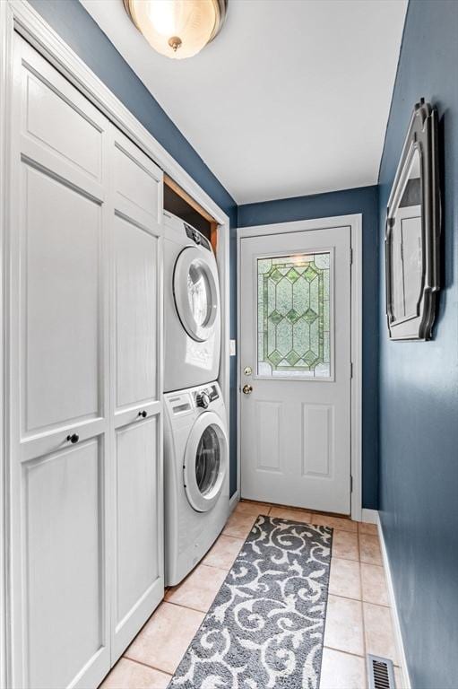 17 High St, Merrimac, MA 01860 - washroom with stacked washer / drying machine, light tile patterned floors, and baseboards