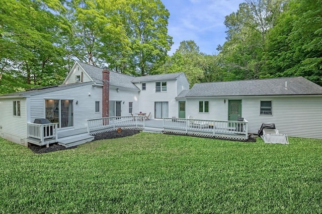 17 High St, Merrimac, MA 01860 - back of property featuring a wooden deck, a yard, roof with shingles, and a chimney