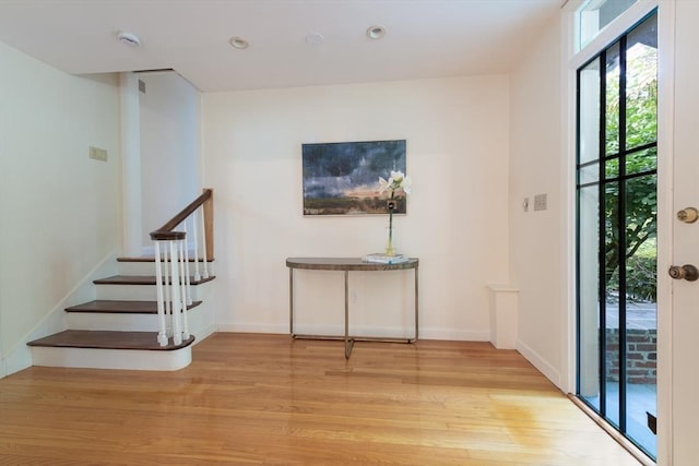 foyer entrance with light hardwood / wood-style flooring