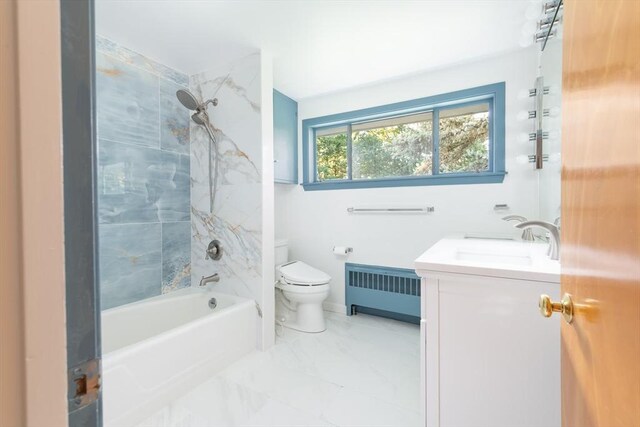 full bathroom with toilet, tiled shower / bath combo, vanity, and radiator heating unit