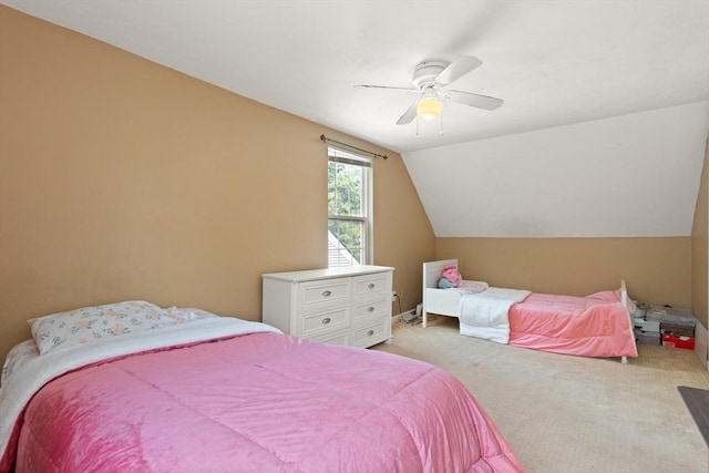 bedroom with light colored carpet, ceiling fan, and lofted ceiling
