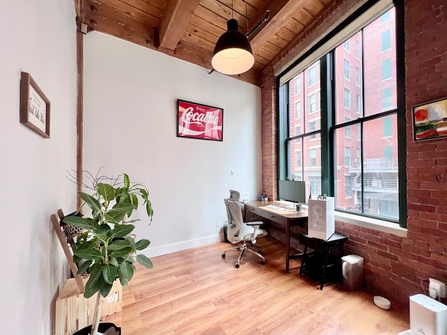 office with light hardwood / wood-style flooring, plenty of natural light, and wooden ceiling