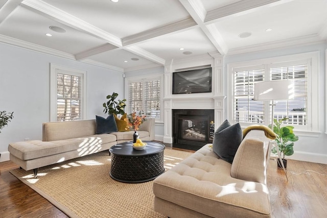 living room with beamed ceiling, ornamental molding, coffered ceiling, and hardwood / wood-style floors