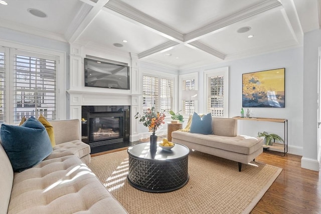 living room with coffered ceiling, hardwood / wood-style floors, beam ceiling, and crown molding