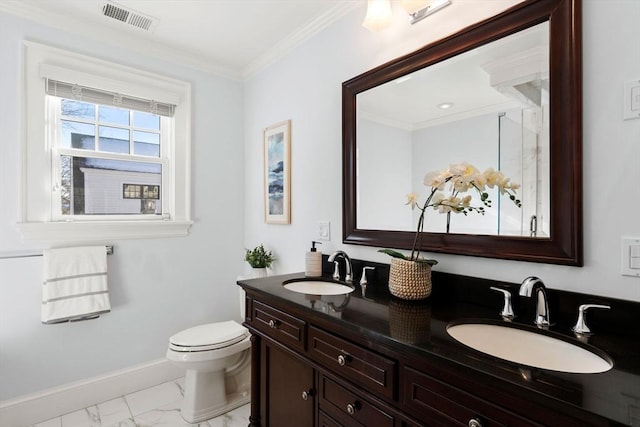 bathroom featuring vanity, ornamental molding, and toilet