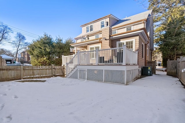 back of house featuring a wooden deck and central AC