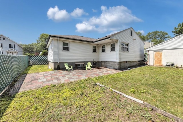 35 Freeman Ave, Boston, MA 02132 - rear view of house with a patio area and a fenced backyard