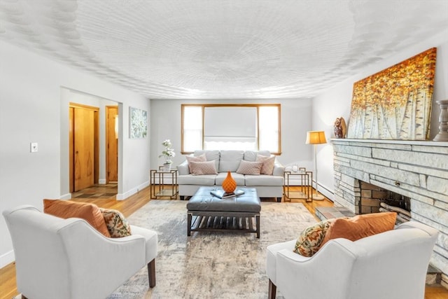 35 Freeman Ave, Boston, MA 02132 - living room featuring a stone fireplace and wood finished floors