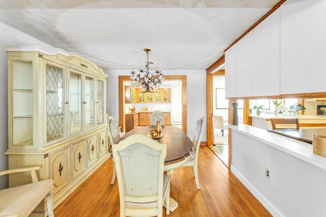 35 Freeman Ave, Boston, MA 02132 - dining space featuring a chandelier and light wood finished floors