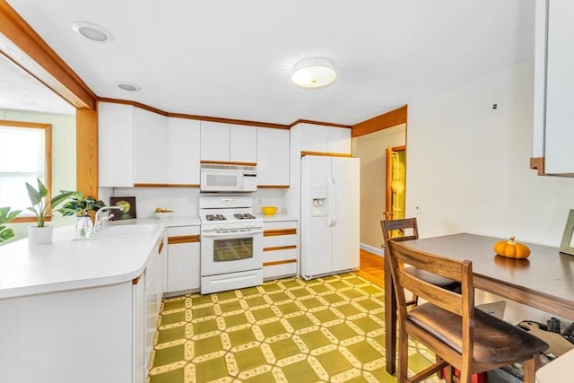 35 Freeman Ave, Boston, MA 02132 - kitchen featuring white appliances, light countertops, and white cabinets