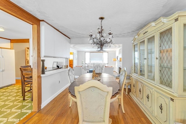 35 Freeman Ave, Boston, MA 02132 - dining area with a chandelier and light wood-type flooring