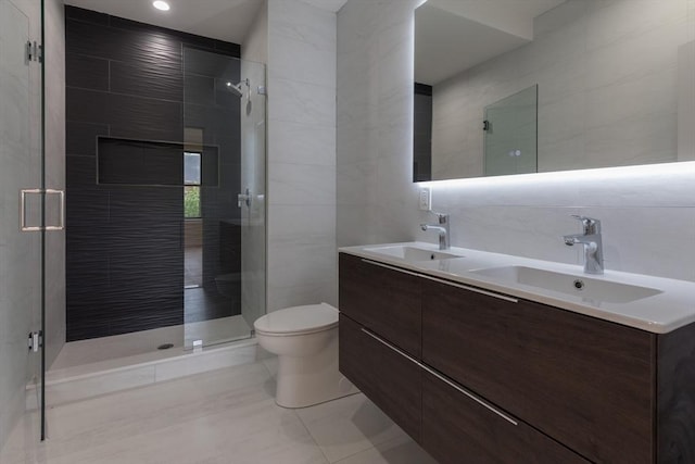 577 Massachusetts Ave Ph, Ph, Boston, MA 02118 - full bathroom featuring tile walls, a shower stall, double vanity, and toilet
