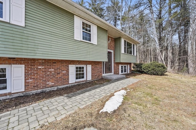 view of property exterior featuring brick siding