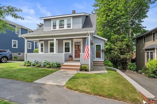 41 Dale Ave, Quincy, MA 02169 - bungalow-style home featuring covered porch, a shingled roof, a front yard, and a chimney