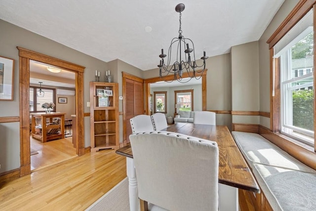 41 Dale Ave, Quincy, MA 02169 - dining room featuring a chandelier, light wood-style flooring, and plenty of natural light