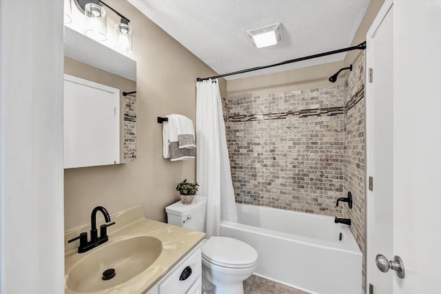 full bathroom with a textured ceiling, shower / tub combo, vanity, and toilet