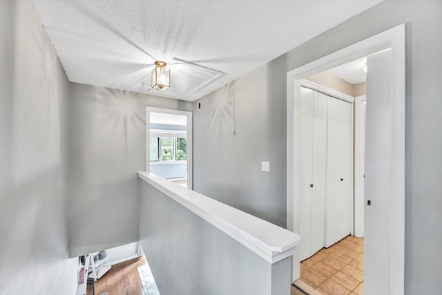 corridor with a textured ceiling