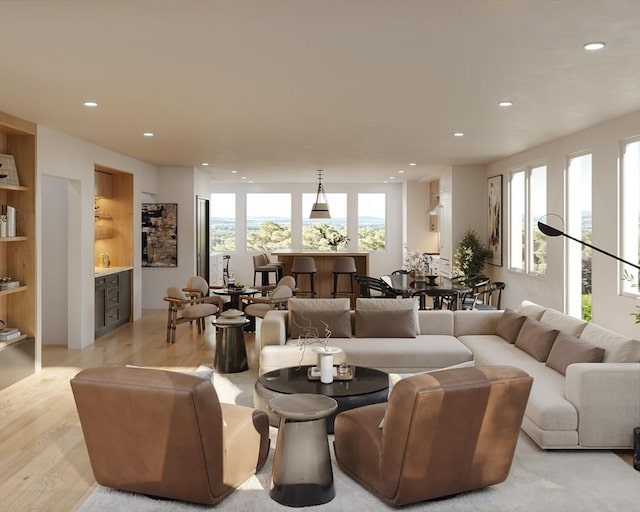 living room featuring light hardwood / wood-style flooring and plenty of natural light