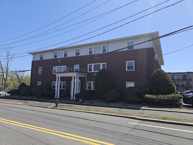 townhome / multi-family property with brick siding