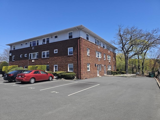 view of property with uncovered parking