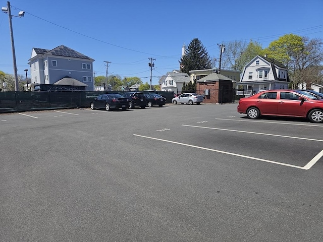 uncovered parking lot with fence