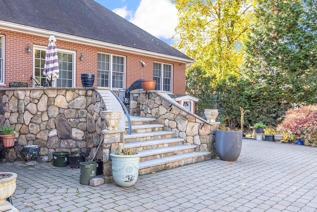 property entrance featuring a patio