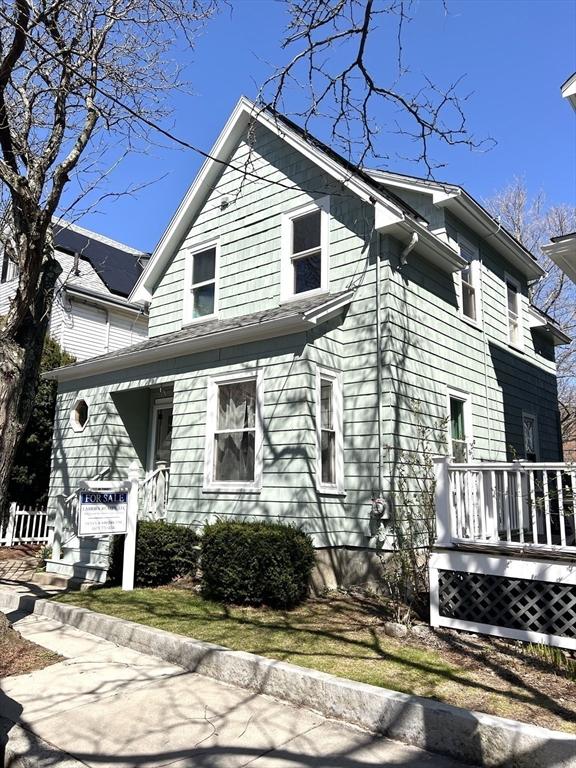 view of home's exterior featuring a wooden deck