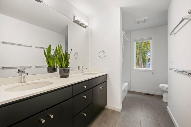 full bathroom featuring tub / shower combination, toilet, and vanity