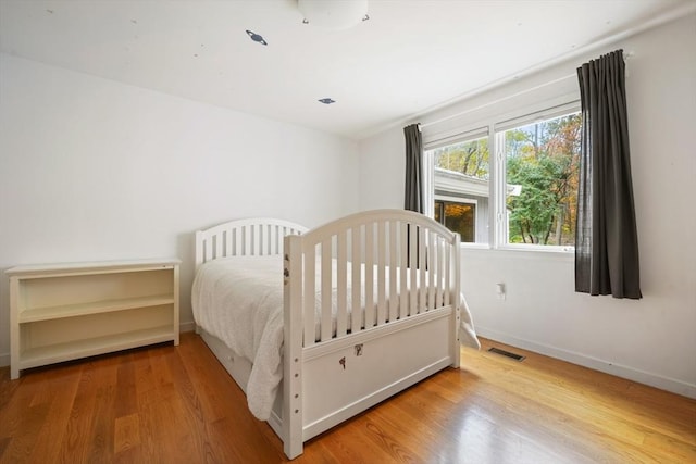 bedroom featuring hardwood / wood-style floors