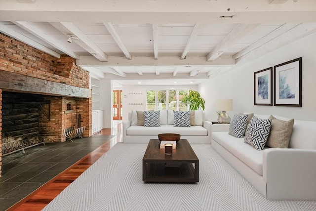 living room with beamed ceiling and a fireplace