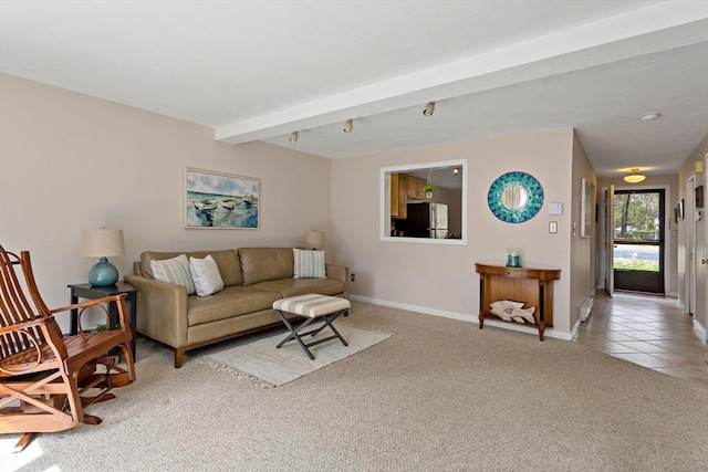 living area featuring baseboards, light carpet, light tile patterned flooring, and beam ceiling