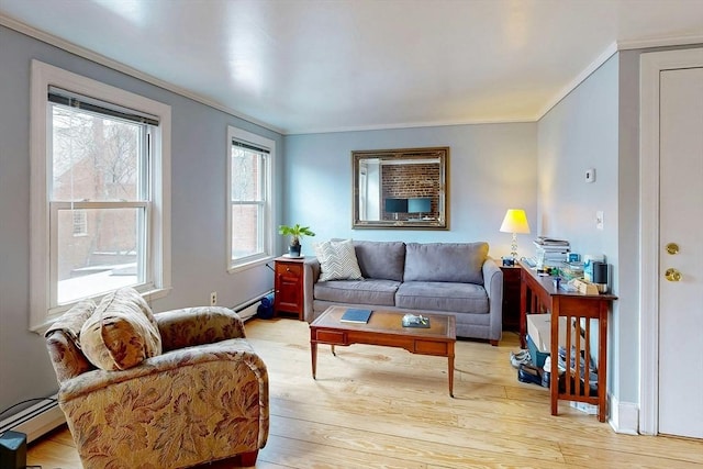 living area with a baseboard heating unit, light wood finished floors, baseboard heating, and crown molding