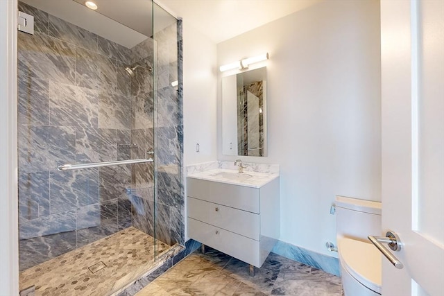 bathroom featuring vanity, an enclosed shower, and toilet