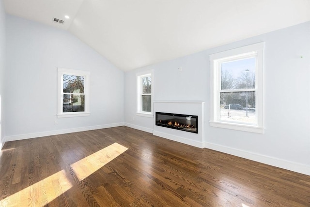 unfurnished living room with lofted ceiling and dark wood-type flooring