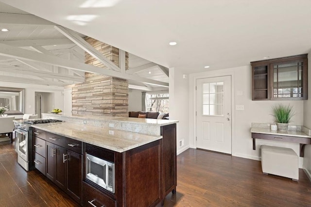 kitchen with dark brown cabinetry, vaulted ceiling with beams, stainless steel appliances, and dark wood-style flooring