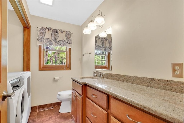 5 Evergreen Cir, Wilbraham, MA 01095 - bathroom with washing machine and clothes dryer, vanity, toilet, baseboards, and tile patterned floors