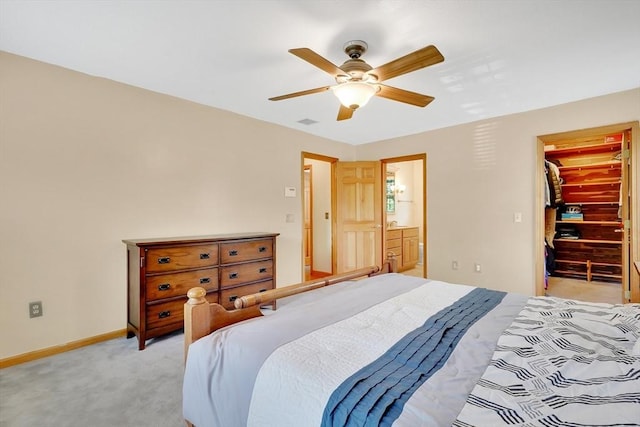 5 Evergreen Cir, Wilbraham, MA 01095 - bedroom featuring light colored carpet, baseboards, a spacious closet, ceiling fan, and connected bathroom