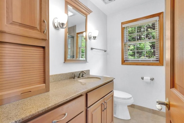 5 Evergreen Cir, Wilbraham, MA 01095 - full bathroom featuring toilet, vanity, a shower with shower door, tile patterned floors, and baseboards