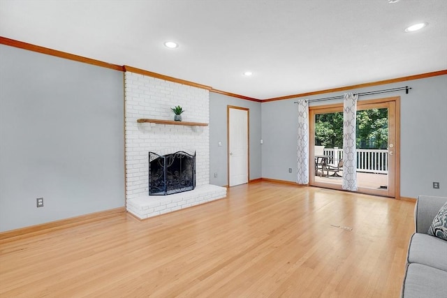 5 Evergreen Cir, Wilbraham, MA 01095 - unfurnished living room with crown molding, wood finished floors, a brick fireplace, recessed lighting, and baseboards