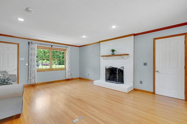 5 Evergreen Cir, Wilbraham, MA 01095 - unfurnished living room featuring crown molding, light wood finished floors, baseboards, a fireplace, and recessed lighting