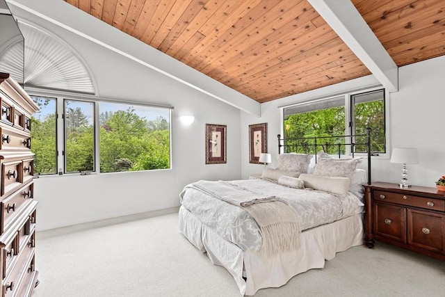 bedroom with lofted ceiling, light carpet, wood ceiling, and baseboards