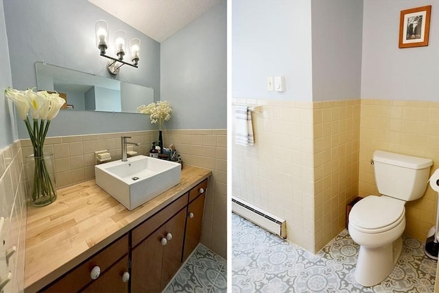 120 Tracy Cir, Amherst, MA 01002 - bathroom featuring a baseboard radiator, tile walls, a wainscoted wall, toilet, and tile patterned flooring