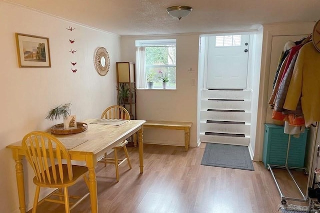120 Tracy Cir, Amherst, MA 01002 - dining room featuring light wood-style flooring and crown molding