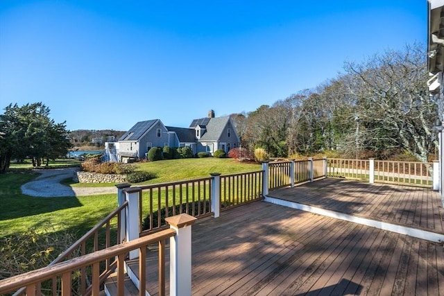 wooden terrace with a yard