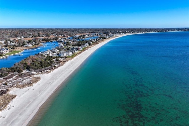 birds eye view of property with a beach view and a water view