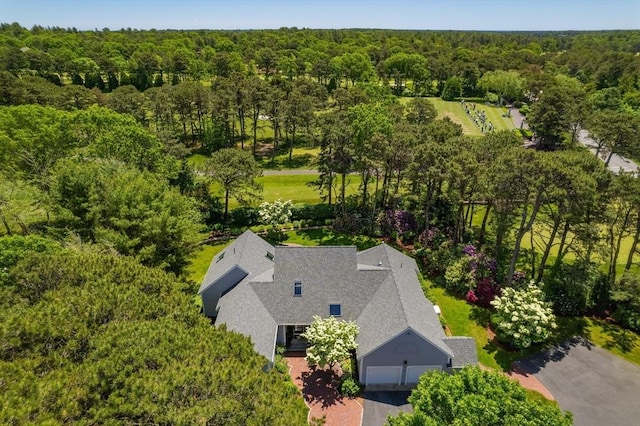 bird's eye view featuring a wooded view