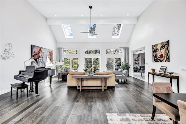 living room featuring dark wood-style floors, a skylight, and a healthy amount of sunlight