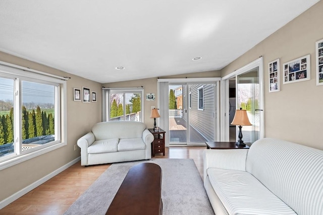 12 Jacobs Ave, Danvers, MA 01923 - living room featuring light wood finished floors, baseboards, vaulted ceiling, and recessed lighting