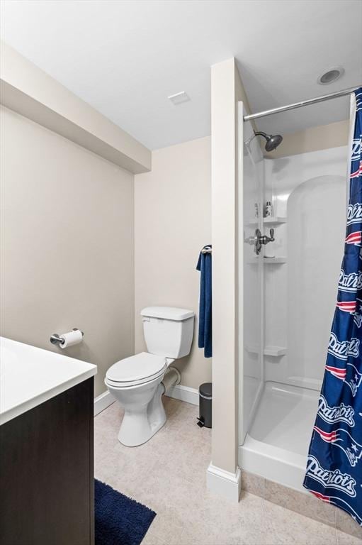 12 Jacobs Ave, Danvers, MA 01923 - bathroom with a shower stall, toilet, baseboards, and vanity